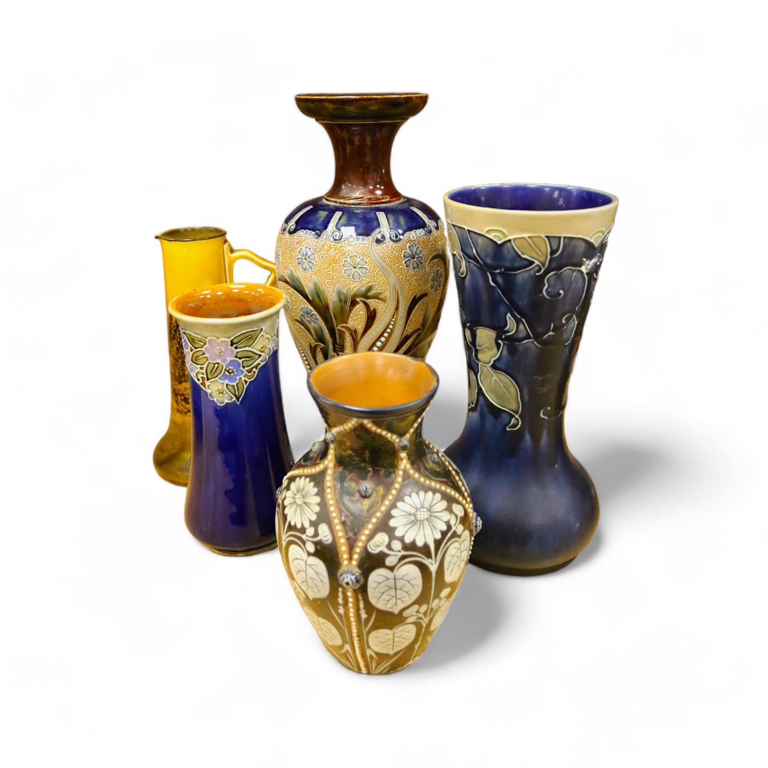 Four Royal Doulton vases and a yellow glazed jug items, tallest vase 34cm high. Condition - some crazing and faults, large vase has damage to lower neck